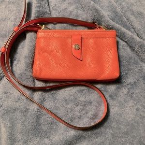 Michael Kors cross body/Shoulder/clutch purse. An orangey salmon colored.